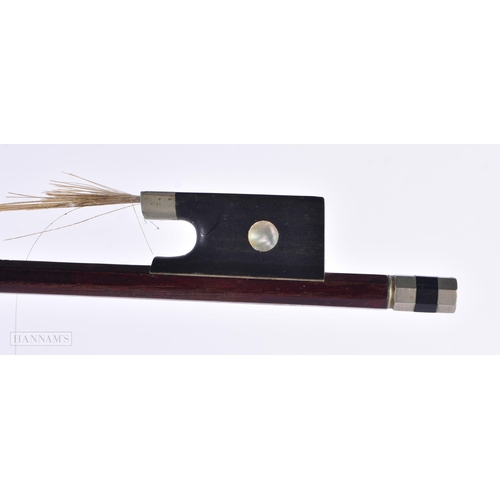 815 - A VIOLIN BOW by Schultz. 72 cm long.