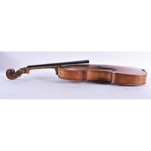 816 - AN ANTIQUE VIOLIN bearing label to interior Joseph Guarnerius. 59 cm long, length of back not inc hu... 