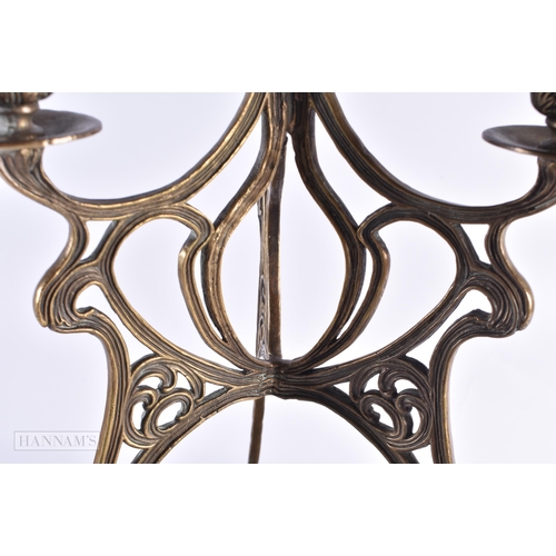 817 - A CONTINENTAL BRONZE AND CERAMIC CENTREPIECE decorated with stylised flowers. 42 cm high.