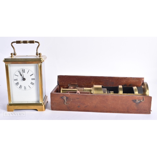 820 - A FRENCH CARRIAGE CLOCK together with a field microscope. Largest 18 cm long. (2)