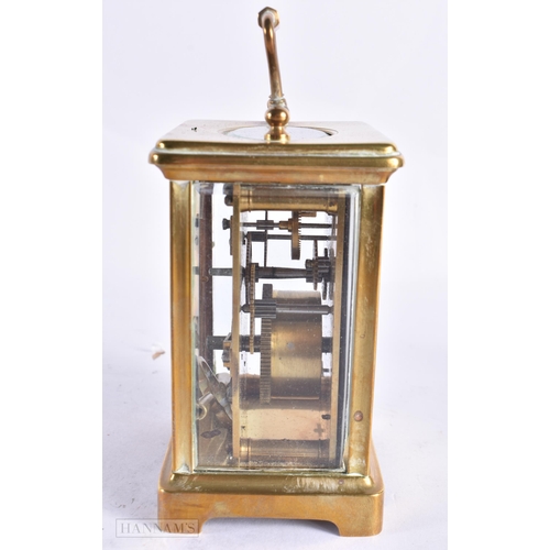 820 - A FRENCH CARRIAGE CLOCK together with a field microscope. Largest 18 cm long. (2)