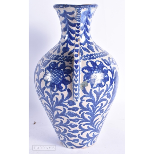 822 - AN ANTIQUE SPANISH TWIN HANDLED POTTERY ALHAMBRA VASE. 27 cm high.