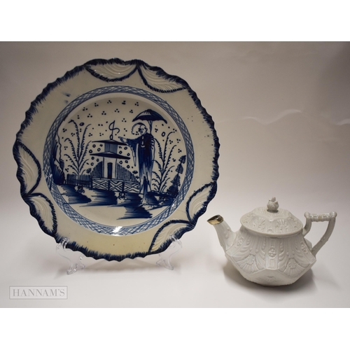 828 - 18th century Staffordshire salt glaze small size teapot and cover and a pearlware plate painted in b... 