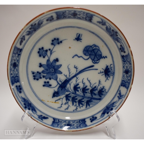 834 - 18th century English delft plate painted in blue with a bird perched on bamboo, the border with diap... 