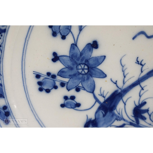 834 - 18th century English delft plate painted in blue with a bird perched on bamboo, the border with diap... 