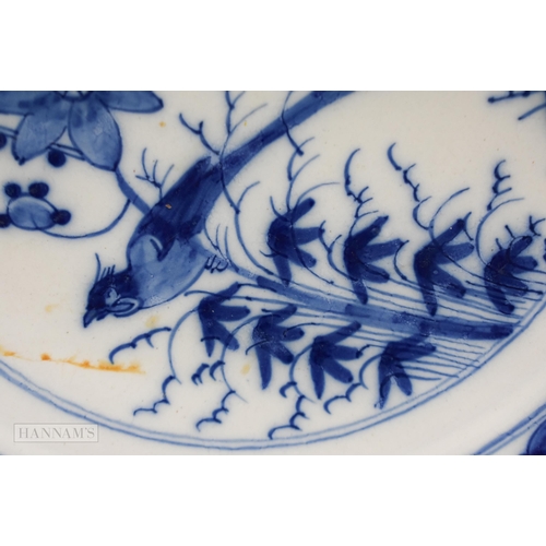 834 - 18th century English delft plate painted in blue with a bird perched on bamboo, the border with diap... 