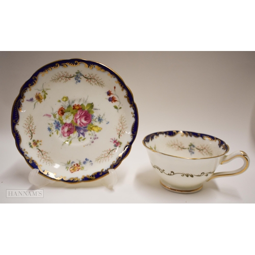 843 - Mid-19th century English teawares: A Coalport cup and saucer painted with flowers pattern 5570, two ... 