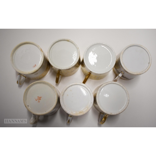 845 - Early 19th century Coalport Derby and Spode coffee cans, four painted with flowers and three with el... 