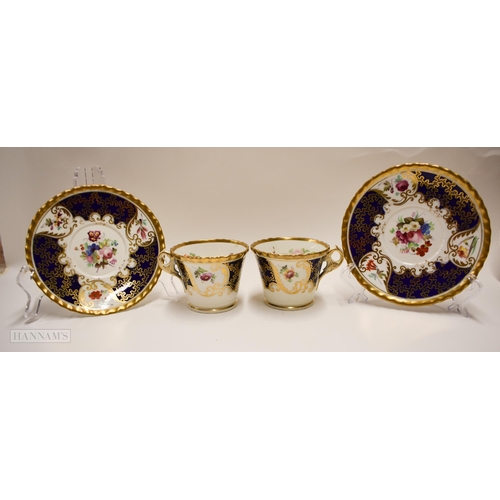 847 - Early 19th century two Chamberlains cups and saucers with gadroon border painted with flowers and t... 