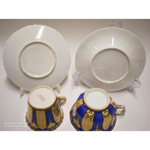 847 - Early 19th century two Chamberlains cups and saucers with gadroon border painted with flowers and t... 