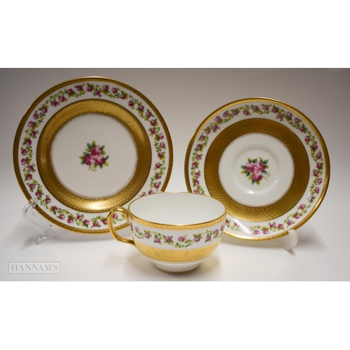 853 - Early 20th century Minton teacup, saucer and side plate painted with trailing roses between thick ac... 