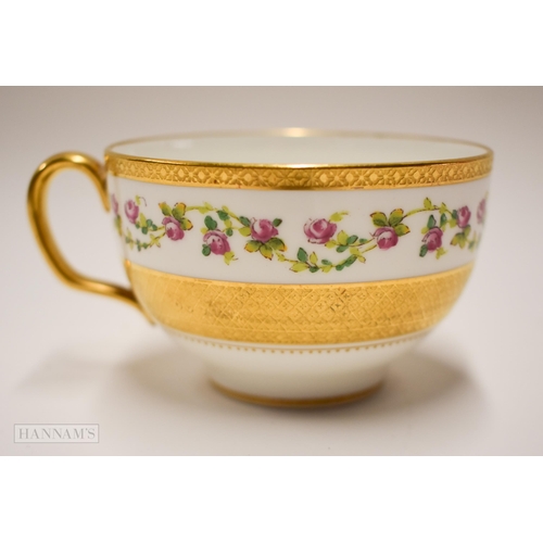 853 - Early 20th century Minton teacup, saucer and side plate painted with trailing roses between thick ac... 