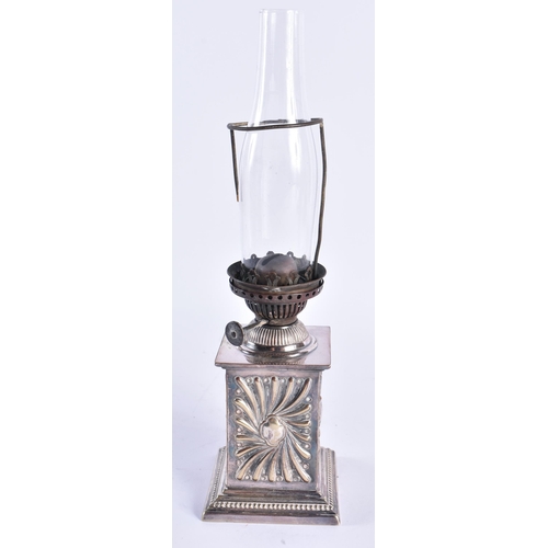 86 - AN ANTIQUE SILVER PLATED OIL LAMP. 32 cm high.