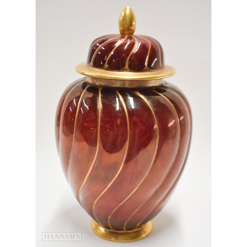 860 - Early 20th century Carltonware Rouge Royal twist moulded vase and cover, the moulding highlighted in... 