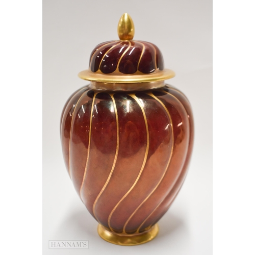 860 - Early 20th century Carltonware Rouge Royal twist moulded vase and cover, the moulding highlighted in... 