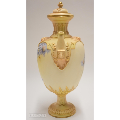 862 - Early 20th century Royal Worcester two handled vase and cover enamelled with blue flowers on a blush... 