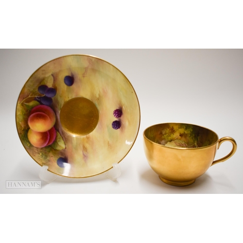 871 - Royal Worcester teacup and saucer, the cup painted inside with fruit by Harry Ayrton, signed the sau... 