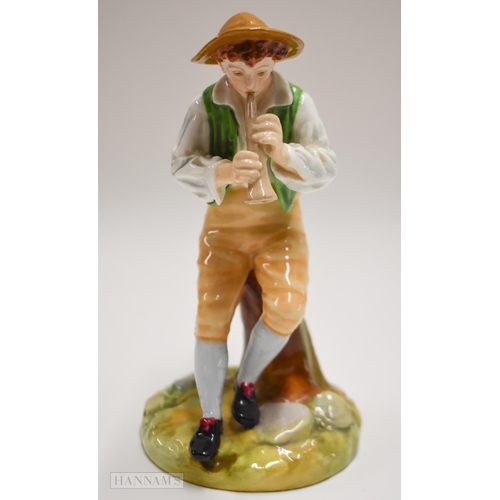 875 - Royal Worcester figure of a boy playing a pipe seated on a tree stump, painted in bright colours, ti... 