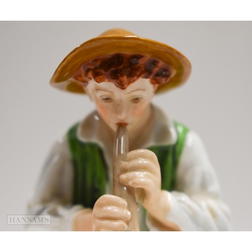 875 - Royal Worcester figure of a boy playing a pipe seated on a tree stump, painted in bright colours, ti... 