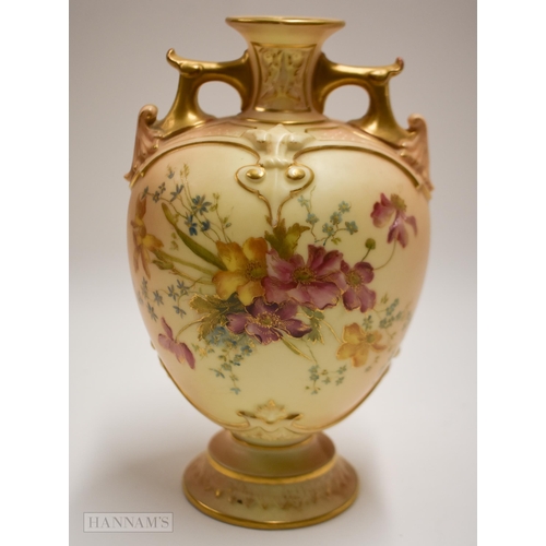 884 - Royal Worcester blush ivory vase on a circular base with twin gilt painted handles, decorated with f... 