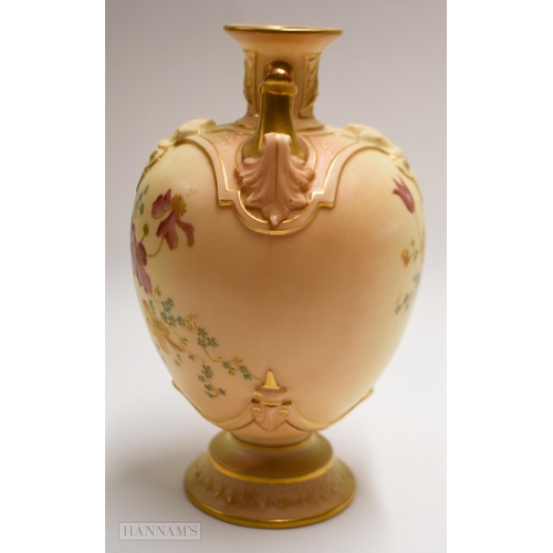 884 - Royal Worcester blush ivory vase on a circular base with twin gilt painted handles, decorated with f... 