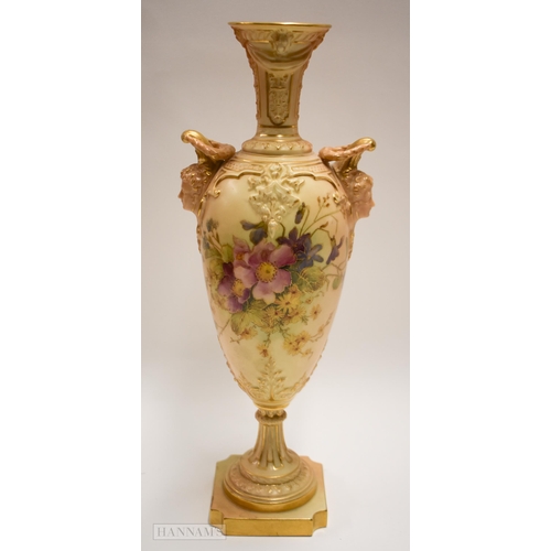 887 - Royal Worcester pedestal vase, with face mask handles and blush painted with flowers, puce marks to ... 