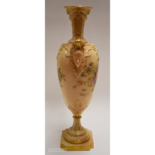 887 - Royal Worcester pedestal vase, with face mask handles and blush painted with flowers, puce marks to ... 