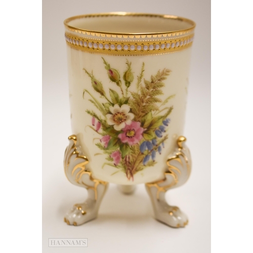 899 - Royal Worcester three footed vase painted with heathers and wild flowers by George Hundley under a j... 