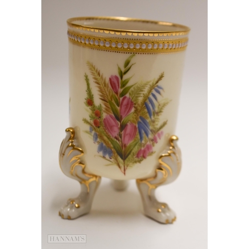 899 - Royal Worcester three footed vase painted with heathers and wild flowers by George Hundley under a j... 