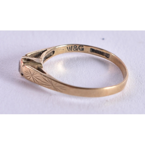 1075 - A 9CT GOLD RING. H. 0.8 grams.