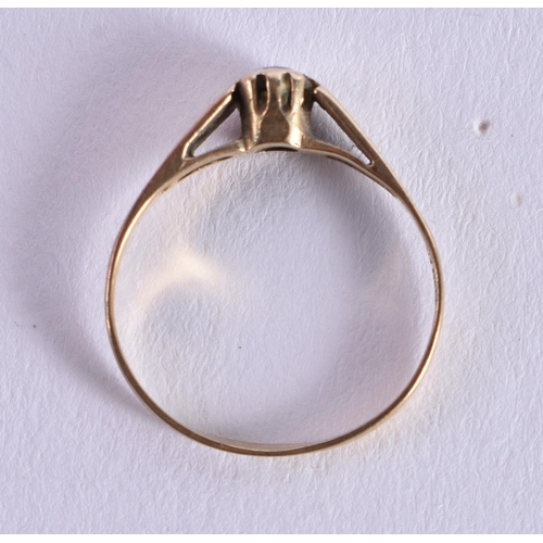 1075 - A 9CT GOLD RING. H. 0.8 grams.