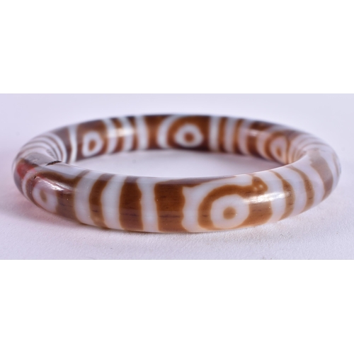 1080 - A TIBETAN BANGLE. 53.6 grams. 6 cm diameter.