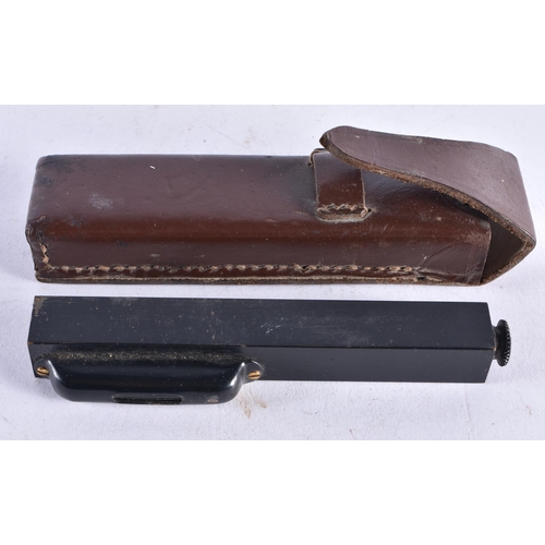 1362 - A LEATHER CASED INCLINOMETER. 12.5 cm long.