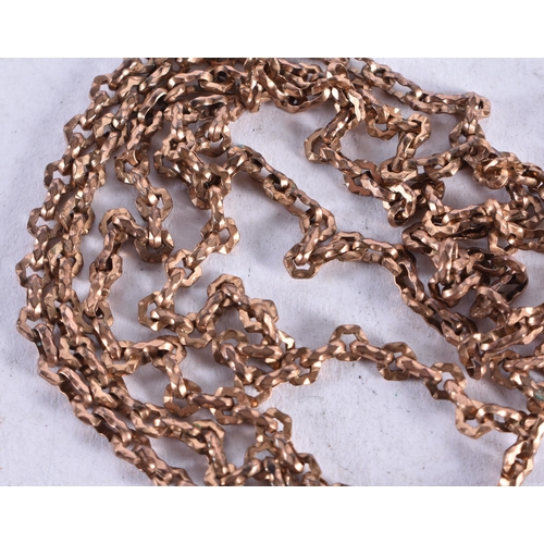 1363 - A LONG YELLOW METAL MUFF CHAIN. 28.5 grams. 149 cm long.