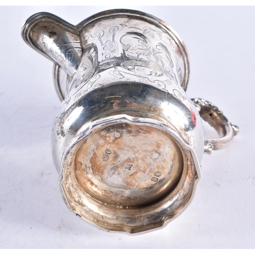 1377 - A VICTORIAN SILVER ENGRAVED JUG. 188 grams.