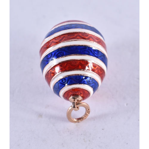 1657 - A 14CT GOLD AND ENAMEL EGG PENDANT. 12.7 grams. 2.5 cm x 1.75 cm.