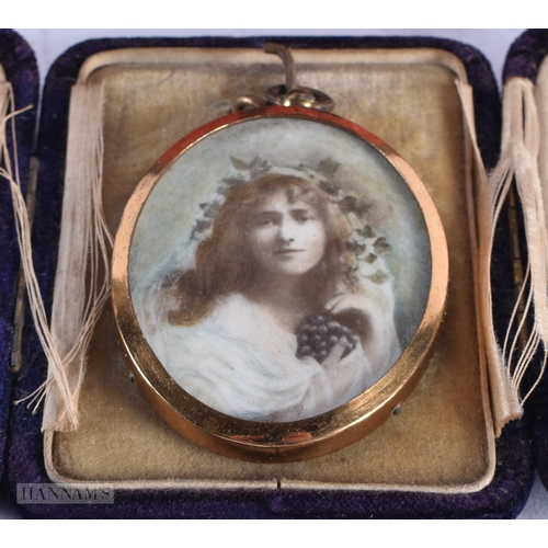 1794 - A SILVER FRAME and a yellow metal locket. (2)