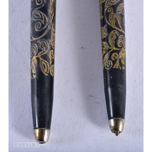 1795 - A PAIR OF CHANEL PENS. 16.9 grams. 13 cm x 1 cm.