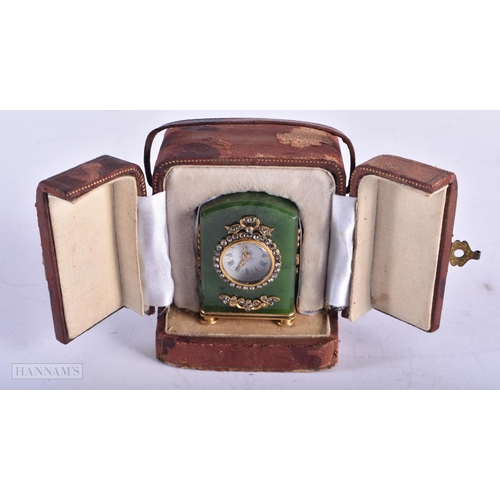 1809 - A CONTINENTAL 14CT GOLD DIAMOND AND JADE TRAVELLING CLOCK. 83 grams. 4.5 cm x 3 cm.