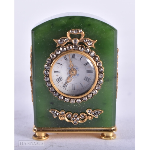 1809 - A CONTINENTAL 14CT GOLD DIAMOND AND JADE TRAVELLING CLOCK. 83 grams. 4.5 cm x 3 cm.