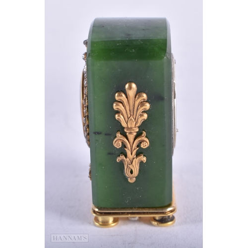 1809 - A CONTINENTAL 14CT GOLD DIAMOND AND JADE TRAVELLING CLOCK. 83 grams. 4.5 cm x 3 cm.