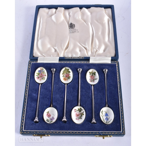 1815 - A CASED SET OF SILVER AND ENAMEL SPOONS. 60 grams. 10 cm long. (6)