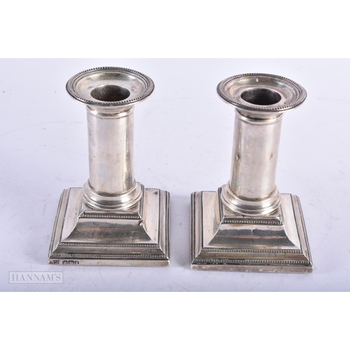 1818 - A PAIR OF VICTORIAN SILVER CANDLESTICKS. Sheffield 1893. 614 grams overall. 10.75 cm high.