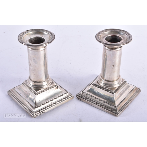 1818 - A PAIR OF VICTORIAN SILVER CANDLESTICKS. Sheffield 1893. 614 grams overall. 10.75 cm high.