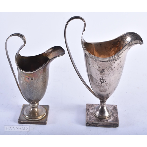 1993 - TWO ANTIQUE SILVER JUGS. 213 grams. Largest 14 cm high. (2)