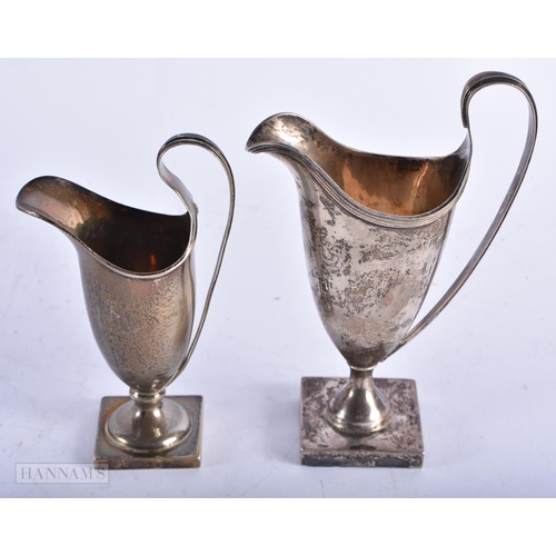 1993 - TWO ANTIQUE SILVER JUGS. 213 grams. Largest 14 cm high. (2)