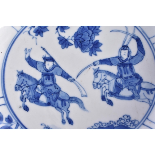 2000 - A FINE 17TH CENTURY CHINESE BLUE AND WHITE PORCELAIN DISH Kangxi mark and period, painted with figur... 