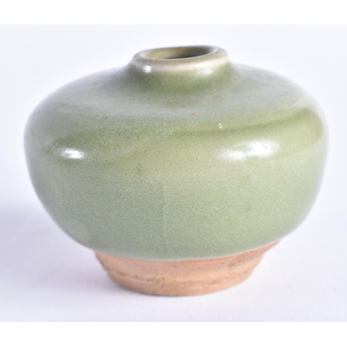 2062 - A CHINESE MING DYNASTY CELADON STONEWARE WATER DROPPER. 6 cm wide.