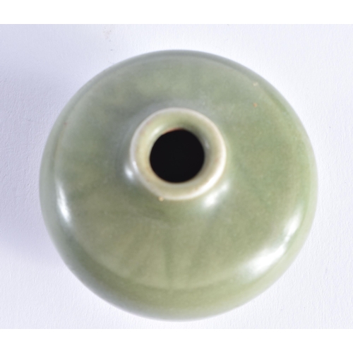 2062 - A CHINESE MING DYNASTY CELADON STONEWARE WATER DROPPER. 6 cm wide.