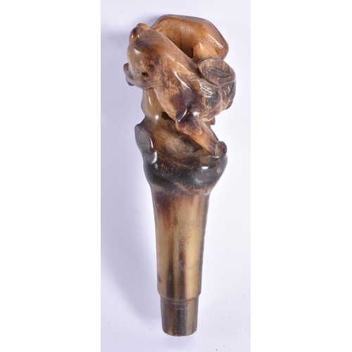 2065 - A 19TH CENTURY CHINESE CARVED BUFFALO HORN CANE HANDLE Late Qing. 103.8 grams. 15.5 cm long.